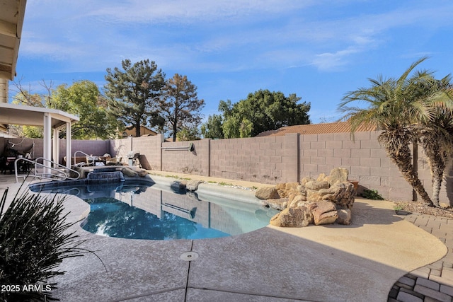 view of swimming pool with a patio