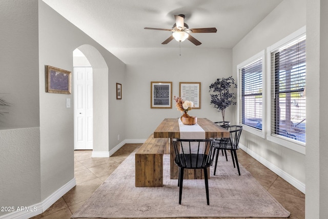 tiled dining room with ceiling fan