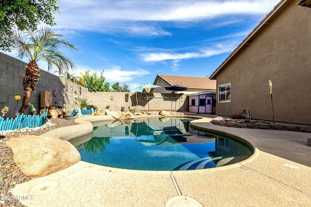 view of swimming pool featuring a fenced in pool and a fenced backyard