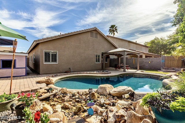view of swimming pool with a fenced backyard, a fenced in pool, a gazebo, and a patio