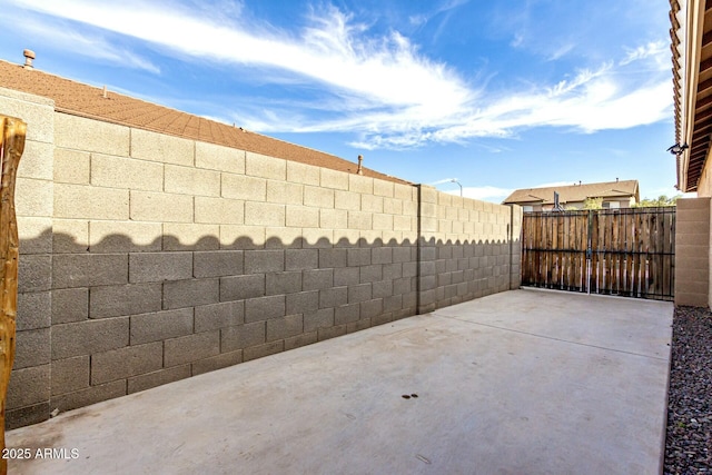 view of patio featuring fence