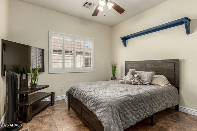 tiled bedroom featuring baseboards, a ceiling fan, and visible vents
