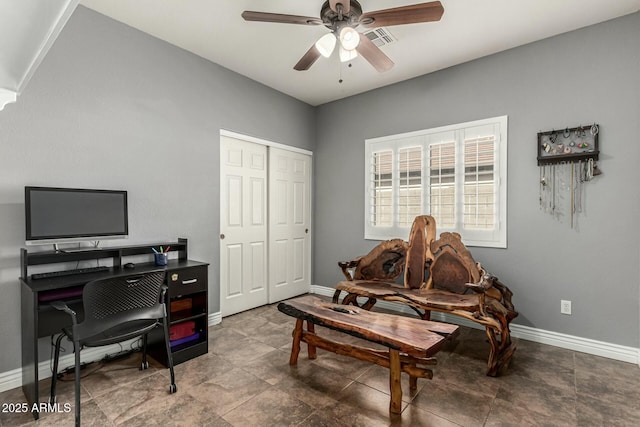 office space featuring visible vents, baseboards, and ceiling fan