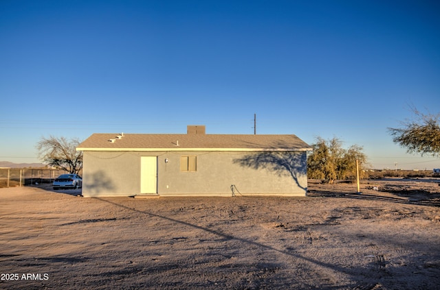 back of property with stucco siding