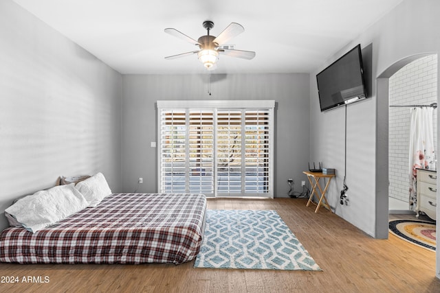 bedroom with ceiling fan and light hardwood / wood-style floors