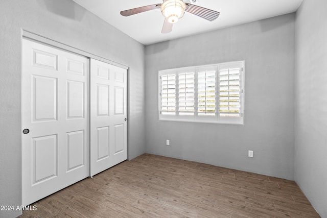 unfurnished bedroom featuring a closet, ceiling fan, and light hardwood / wood-style floors