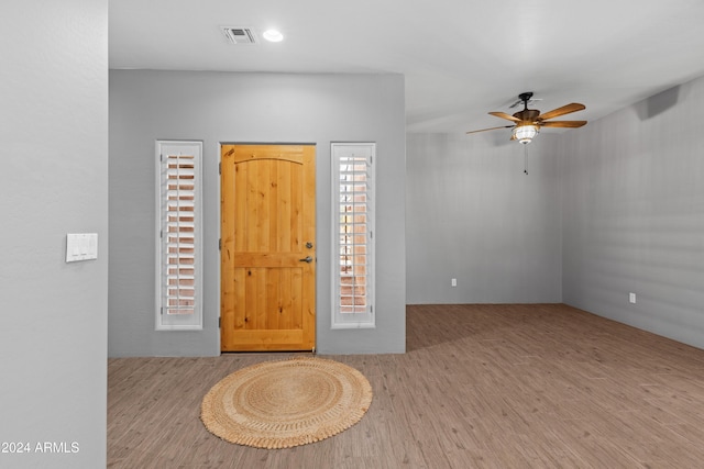 foyer featuring light wood-type flooring and ceiling fan