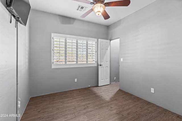 unfurnished bedroom with hardwood / wood-style floors and ceiling fan