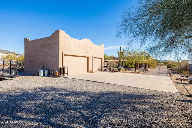 view of side of property with a garage