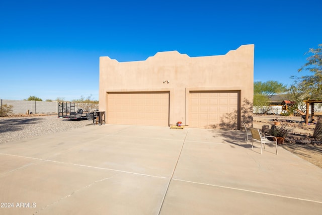 view of side of property featuring a garage