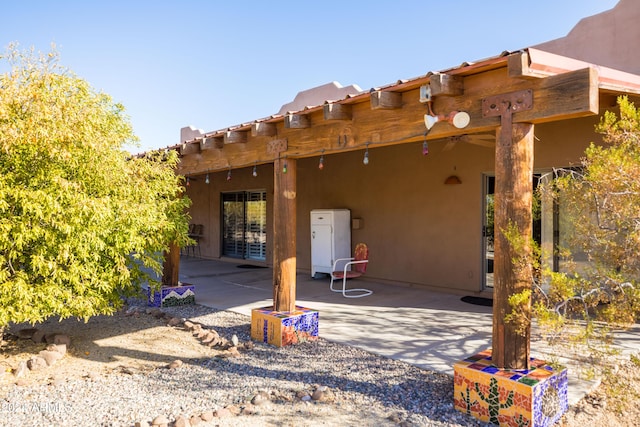 back of house with a patio