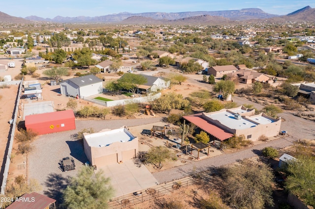 birds eye view of property featuring a mountain view