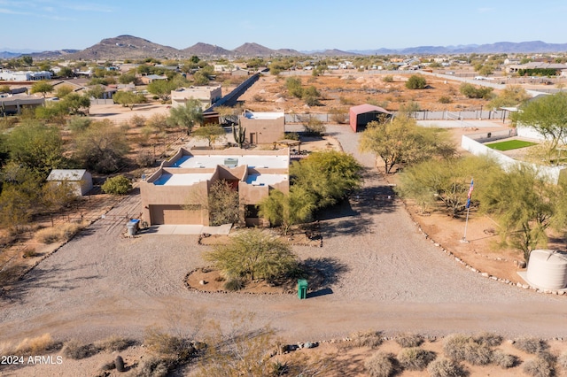 birds eye view of property with a mountain view