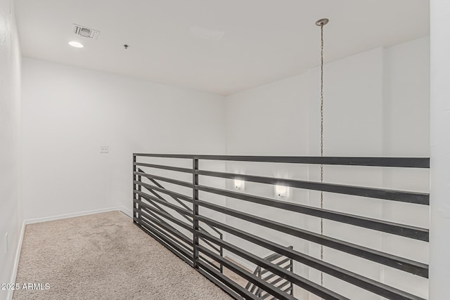 hallway featuring baseboards, carpet, recessed lighting, and visible vents