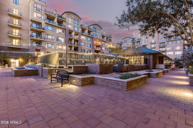 view of home's community with a patio area
