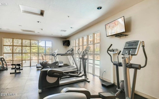 gym with baseboards, recessed lighting, and visible vents