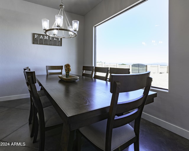 dining space with an inviting chandelier