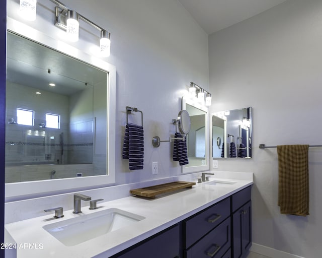 bathroom featuring vanity and tiled shower