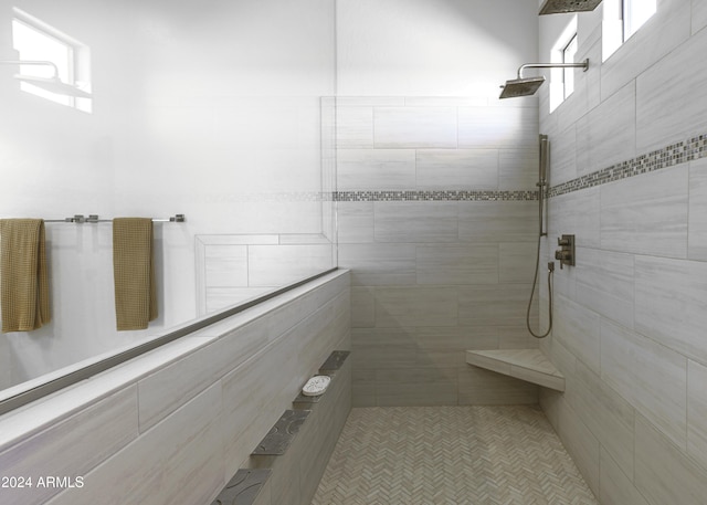 bathroom featuring tiled shower