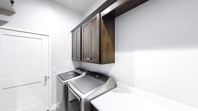 laundry room with cabinets and independent washer and dryer