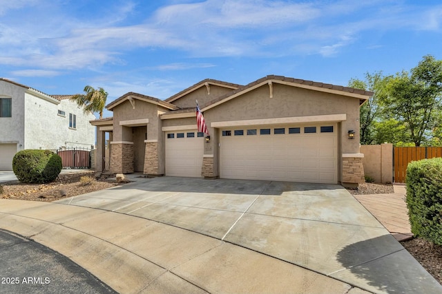 view of front of property featuring stone siding, stucco siding, an attached garage, and driveway