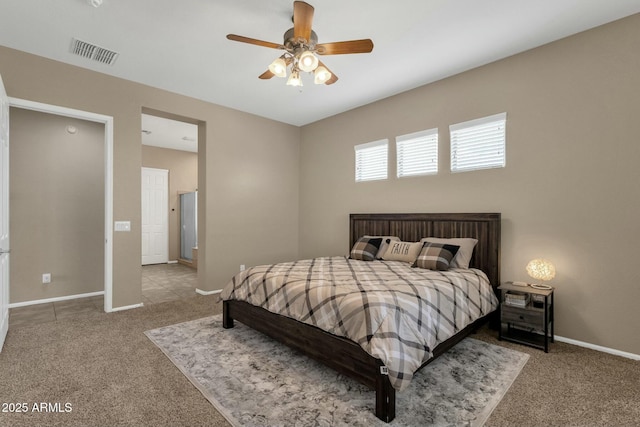 bedroom with visible vents, baseboards, carpet, and a ceiling fan