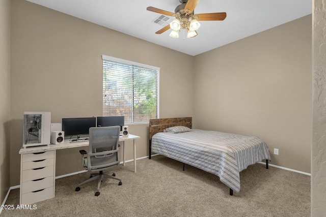 carpeted bedroom featuring visible vents, ceiling fan, and baseboards