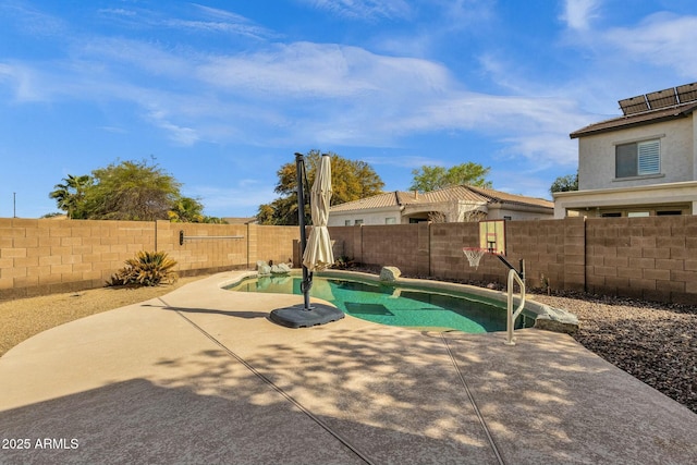 view of swimming pool featuring a patio area, a fenced in pool, and a fenced backyard