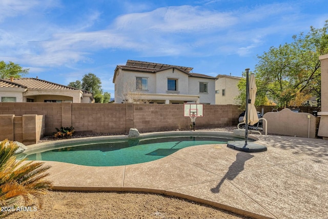 view of pool featuring a patio area, a fenced backyard, and a fenced in pool