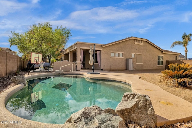 view of swimming pool featuring a patio and a fenced backyard