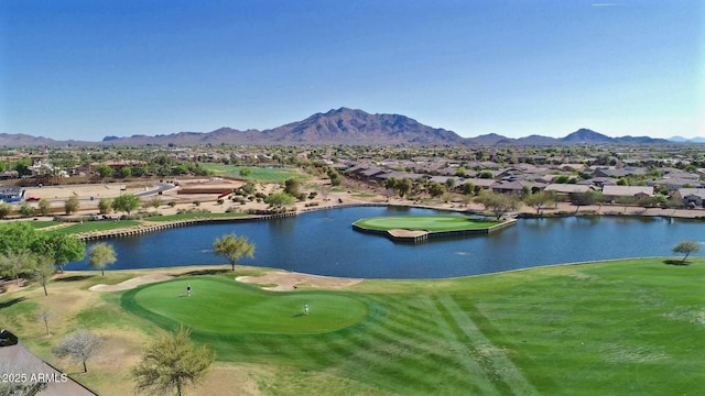 surrounding community with a residential view, a water and mountain view, and view of golf course