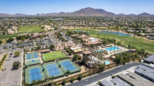 aerial view with golf course view and a mountain view