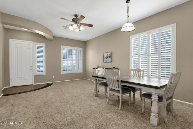 dining area with baseboards, carpet floors, and a ceiling fan