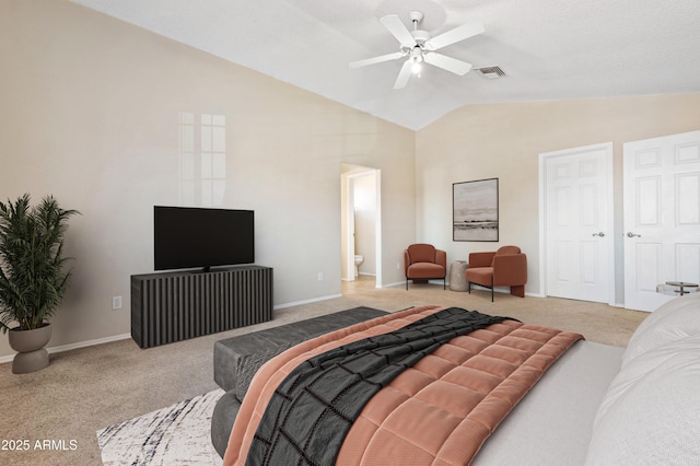 bedroom with light carpet, connected bathroom, lofted ceiling, and ceiling fan