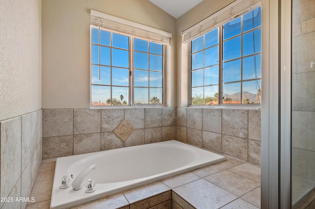 bathroom with tiled tub