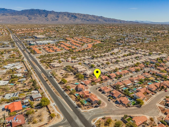 birds eye view of property with a mountain view