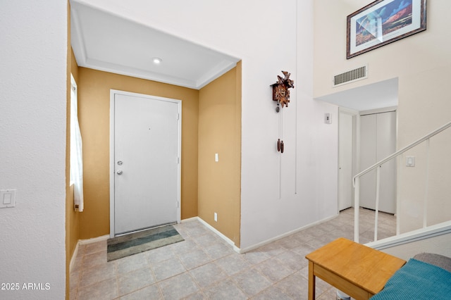 foyer featuring visible vents and baseboards