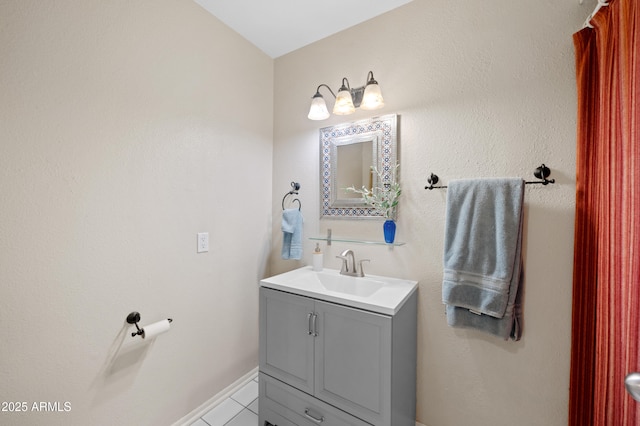 bathroom featuring vanity and baseboards