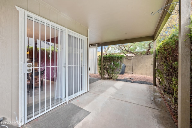 view of patio featuring fence