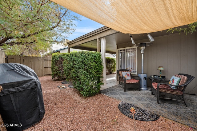 view of patio / terrace with area for grilling and fence