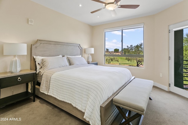 carpeted bedroom featuring access to exterior and ceiling fan