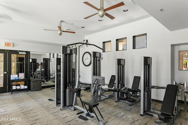 workout area featuring ceiling fan and carpet floors