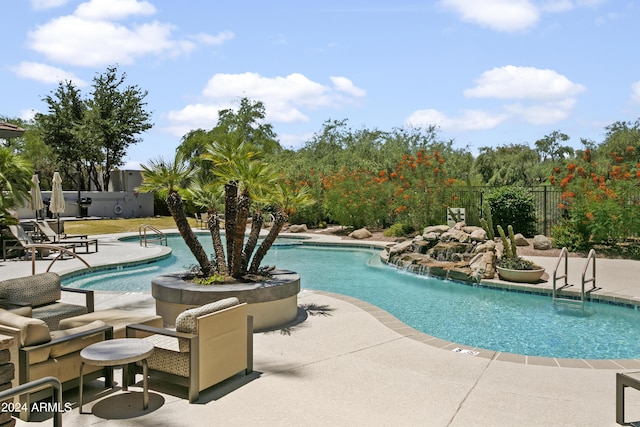 view of swimming pool featuring a patio