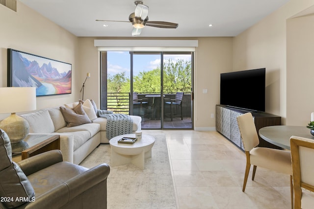 living room with ceiling fan and light tile patterned flooring