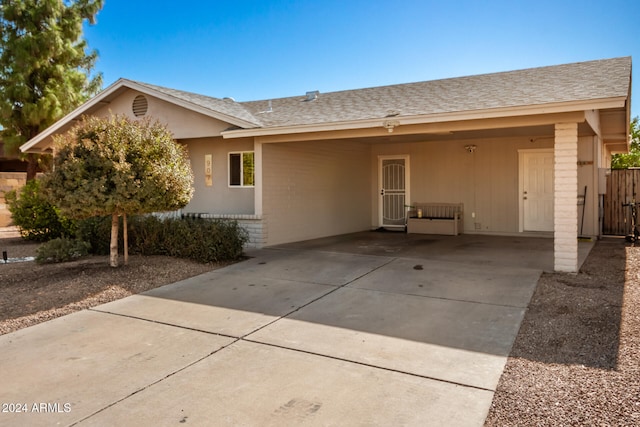 exterior space featuring a carport