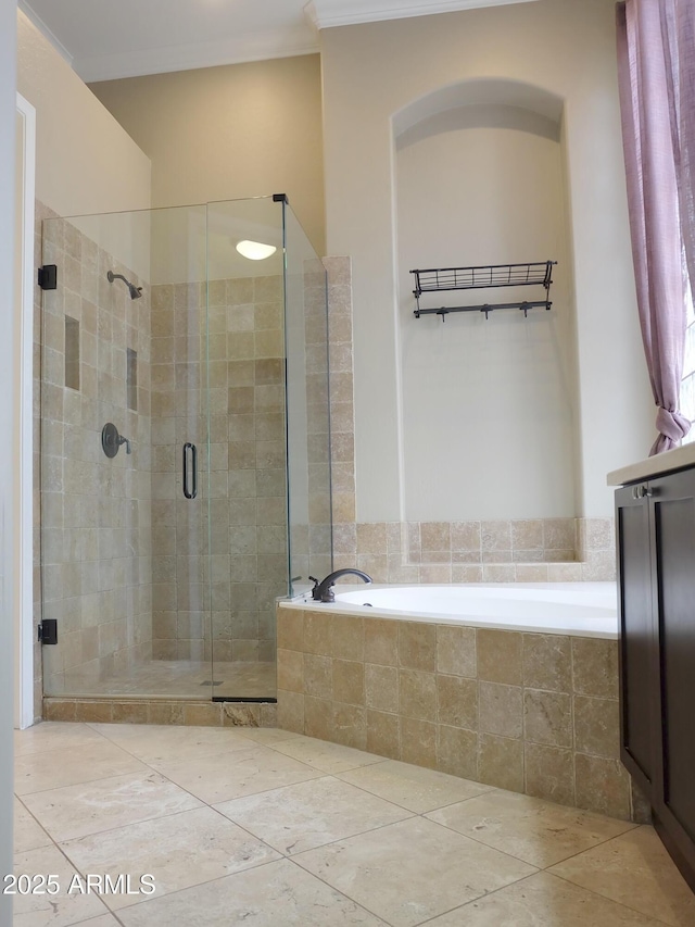 full bathroom with tile patterned flooring, a stall shower, ornamental molding, and a bath