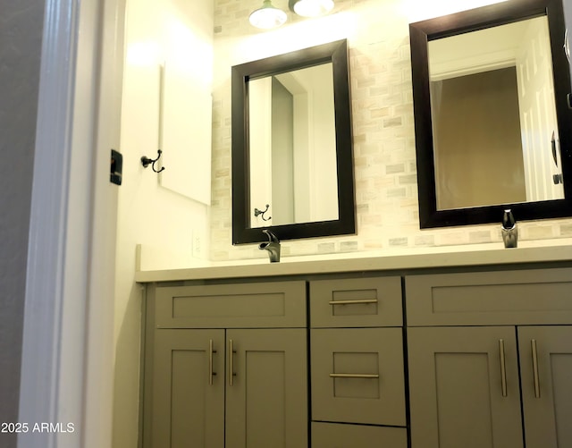 full bathroom with a sink and double vanity