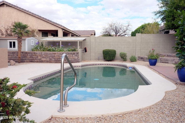 view of swimming pool with a fenced in pool and a fenced backyard