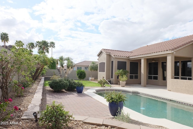 view of swimming pool with a patio area, a fenced in pool, and a fenced backyard