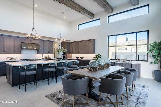 34749 N 83rd Way, Scottsdale, AZ 85266 - tiled dining space with a towering ceiling, sink, a notable chandelier, and beamed ceiling
